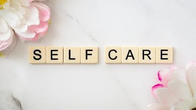 self care written with scrabble pieces