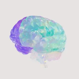 A translucent, multicolored brain model with green, blue, and purple hues on a plain white background symbolizes neurodivergence. The abstract design offers a futuristic and artistic appearance.