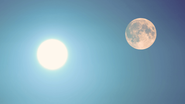 Bright sun and a full moon visible in a clear blue sky, creating a rare celestial alignment that nature seems to offer just when we need it most. It's almost as if the universe itself understands what we treat with awe and wonder.