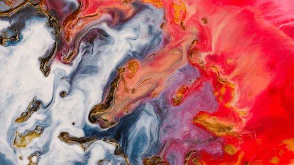 Abstract painting featuring swirling patterns in red, white, black, gold, and blue tones, creating a marbled effect that visually explores the question: What is Trauma through dynamic movement and blending of vibrant colors.